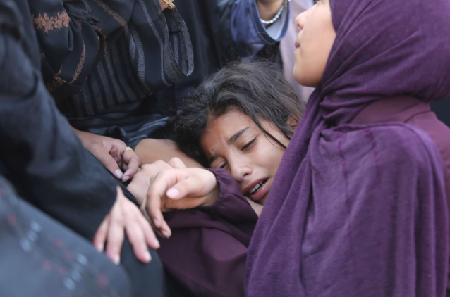 A Palestinian girl cries during the funeral of Amir Ganan, who was killed in an Israeli airstrike on the buildings in Khan Younis, Gaza Strip, Oct. 10, 2023. Hatem Ali/AP
