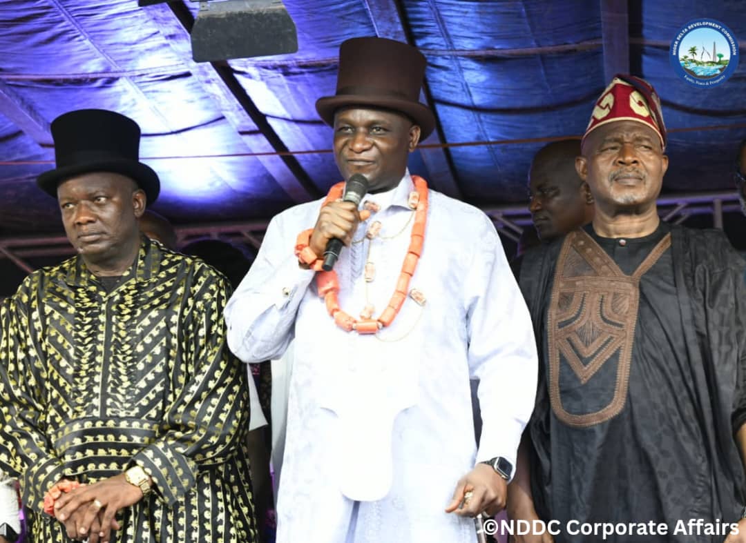 The NDDC Managing Director, Chief Samuel Ogbuku,(middle), speaking during the reception by Yiba-Ama (Oruma) Community at Yiba-Ama School Field in Ogbia Local Government Area of Bayelsa State. He is flanked on the left by the NDDC Executive Director Projects, Chief Victor Antai and the Executive Director Corporate Services, Mr. Ifedayo Abegunde on the right.