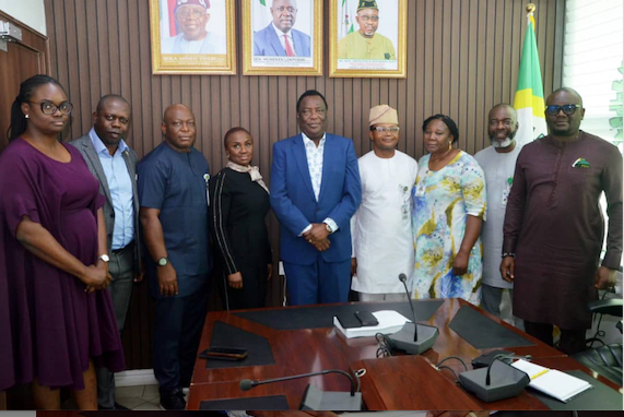 Executive Secretary, Nigerian Content Development and Monitoring Board (NCDMB), Engr. Felix Omatsola Ogbe with some management staff of the Board at the Board's liaison office in Abuja.