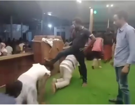 Church members crawl under pastor to cross over into a prosperous 2024 (video)